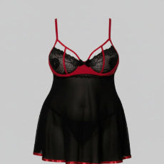 Woman wearing a black and red lingerie set on a plain background